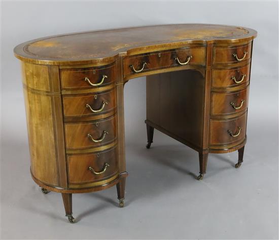 An Edwardian boxwood strung mahogany kidney shaped desk, W.4ft 1.5in. D.2ft 1in. H.2ft 6in.